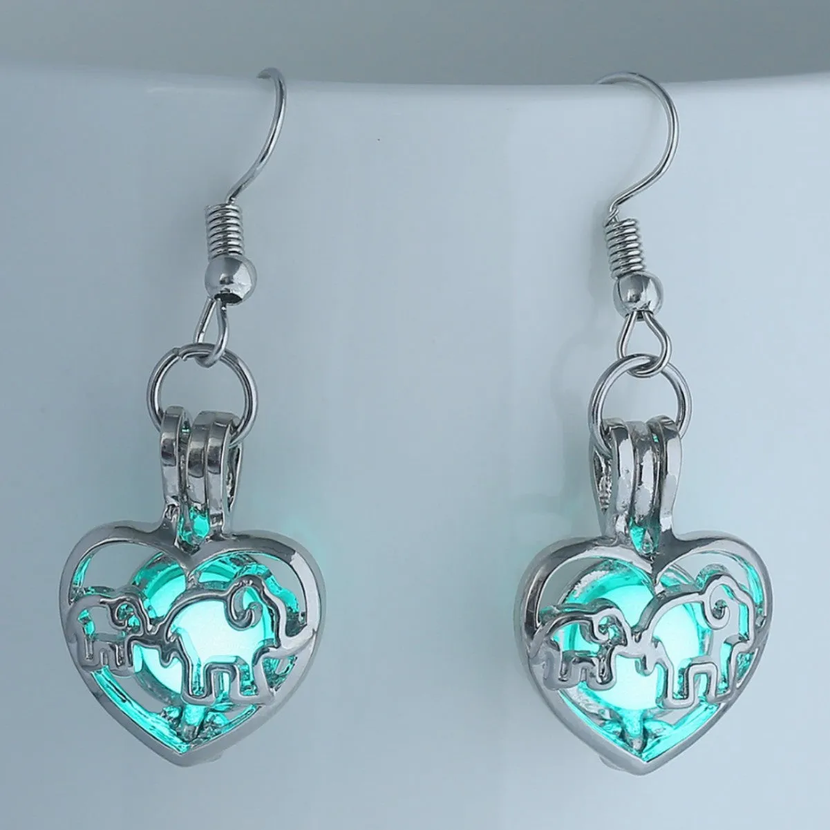 Wholesale Animal elephant baby elephant love hollow luminous earrings