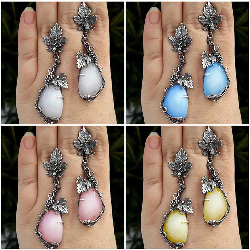 Wholesale Antique Silver Metal Vine Leaf Hand-inlaid White Teardrop-shaped Cat's Eye Earrings