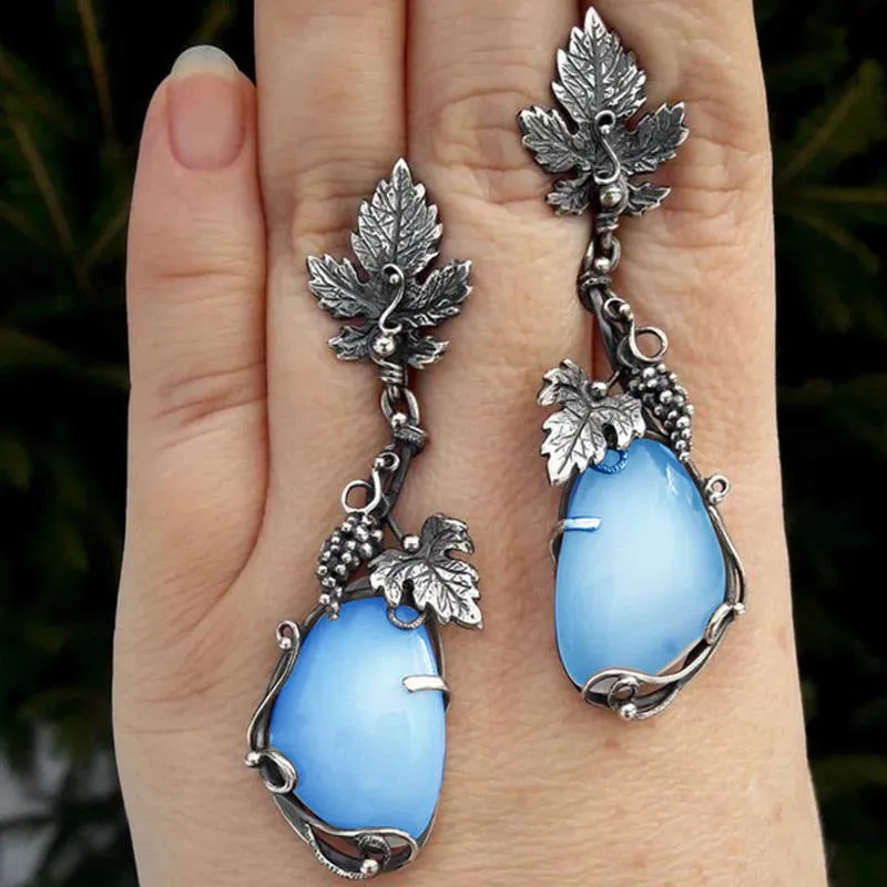 Wholesale Antique Silver Metal Vine Leaf Hand-inlaid White Teardrop-shaped Cat's Eye Earrings