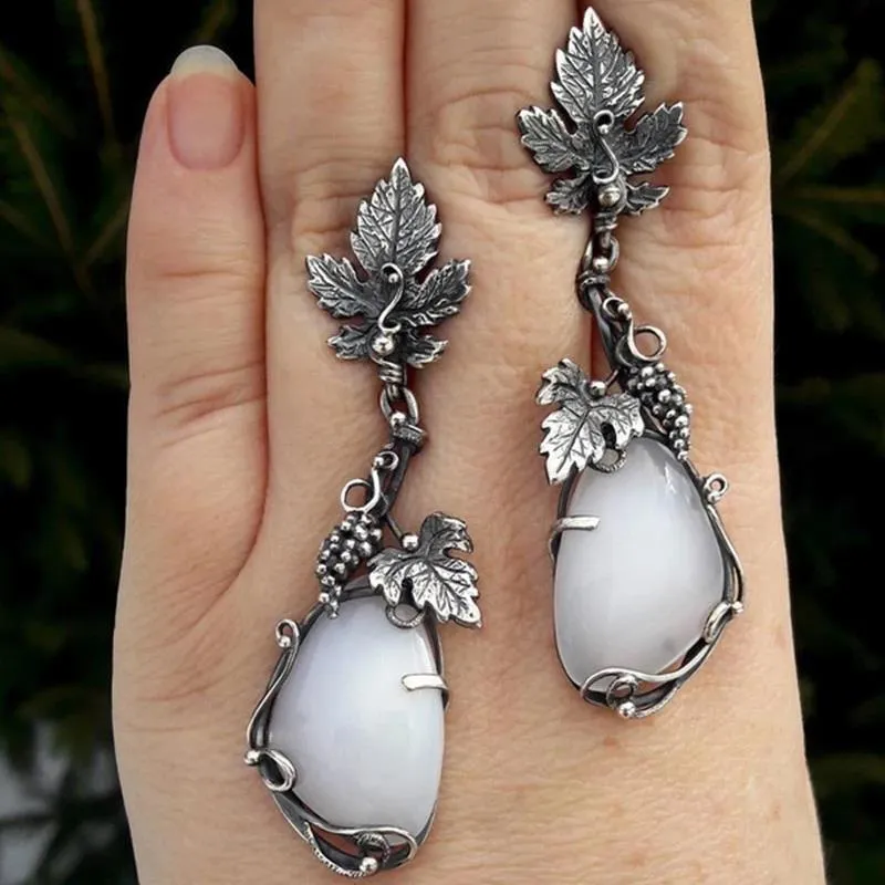 Wholesale Antique Silver Metal Vine Leaf Hand-inlaid White Teardrop-shaped Cat's Eye Earrings