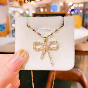 Wholesale 12pcs/pack Titanium Steel Bow Pendant Necklace Earring Set