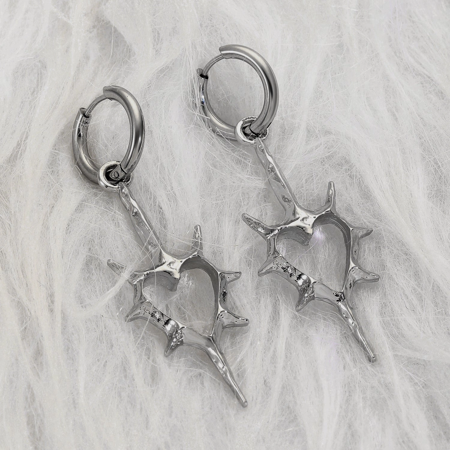 Wholesale Hollow thorn heart earrings