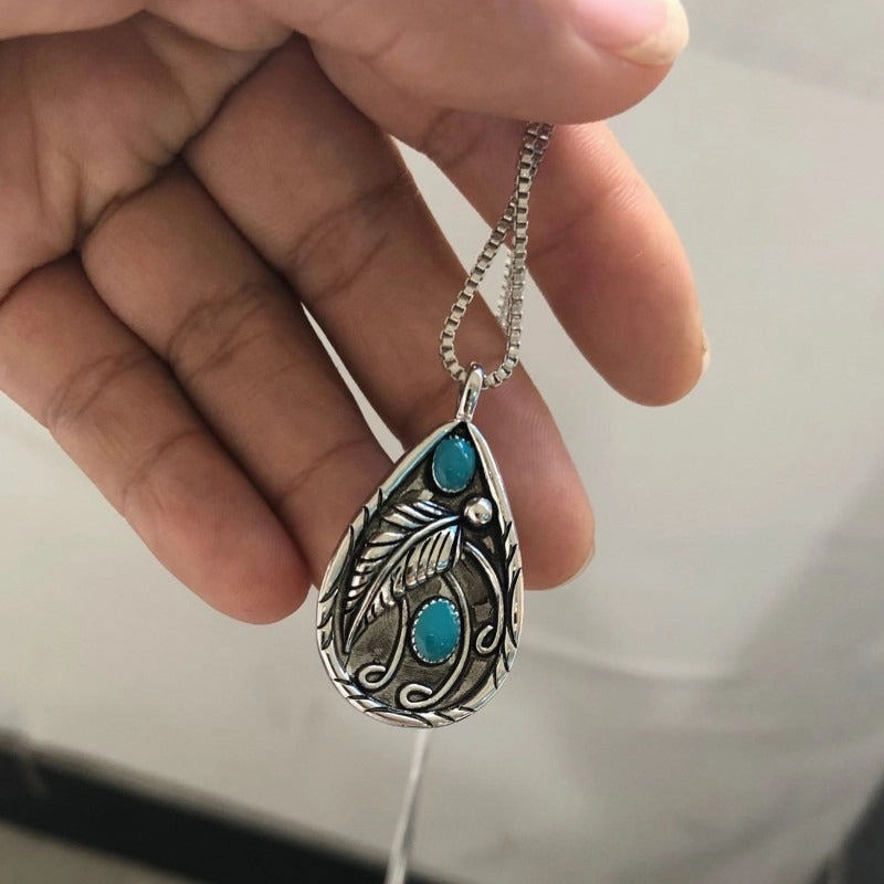 Wholesale Inlaid Turquoise Retro Dyed Black Feather Alloy Pendants