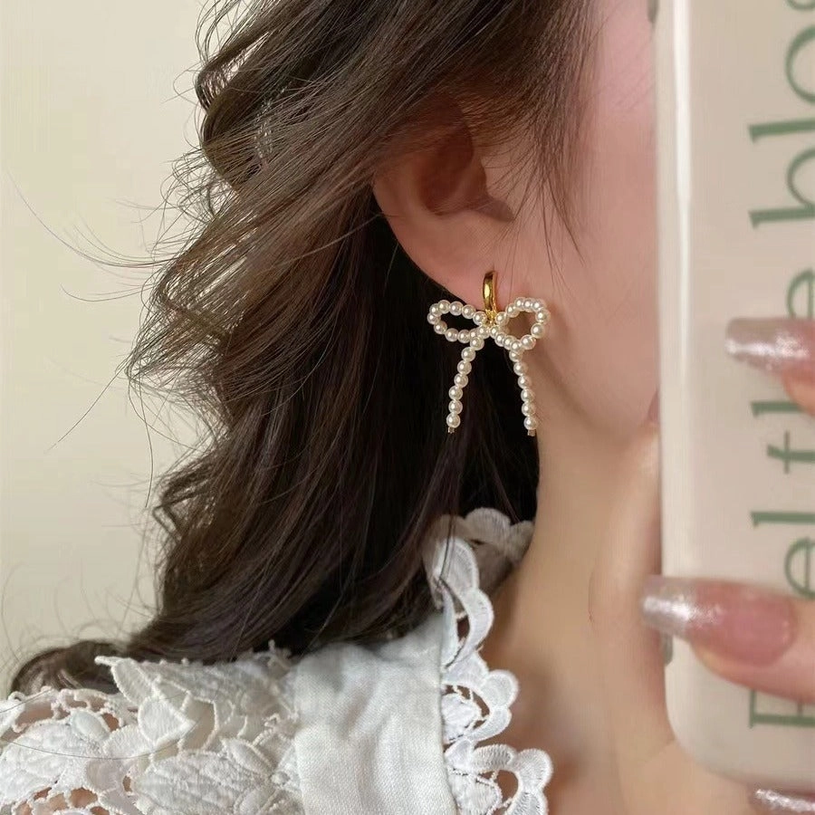 Wholesale Lady-style bow pearl earrings