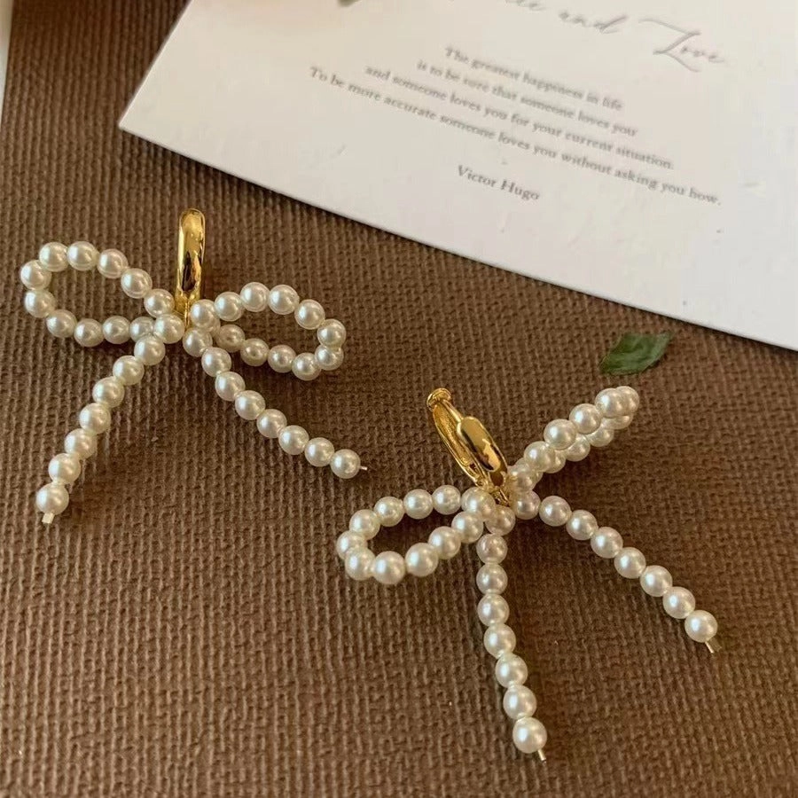 Wholesale Lady-style bow pearl earrings