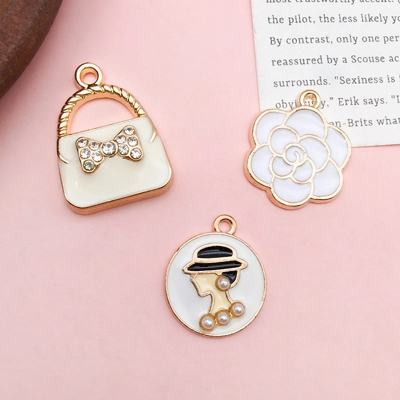 Wholesale Personalized Alloy Oil Dripping Pearl Eye Shadow Flower Perfume Bottle Diy Necklace Pendant Accessories