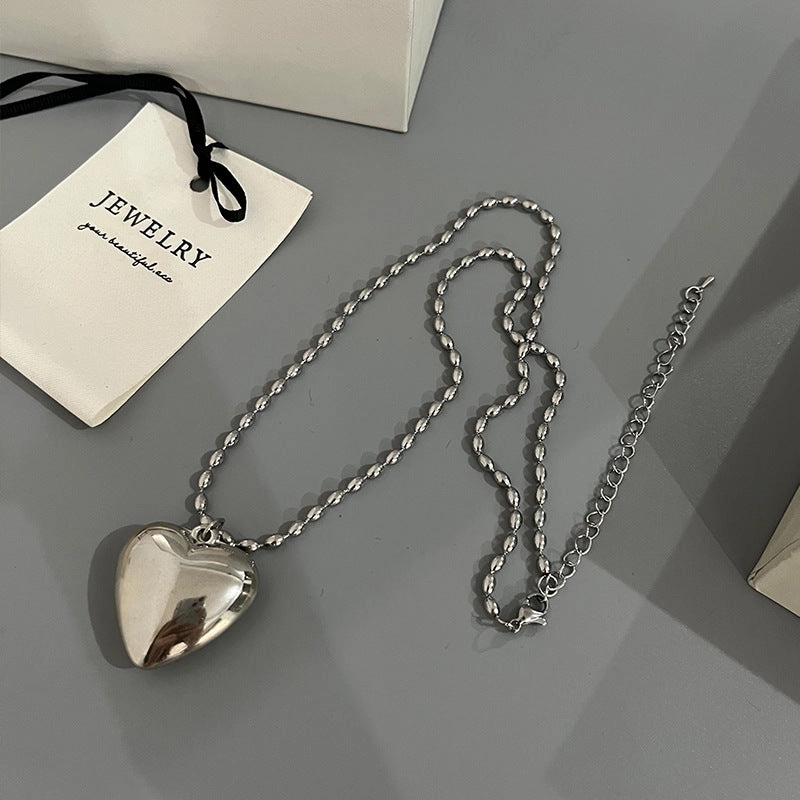 Wholesale Rice Bead Titanium Steel Necklace Hollow Heart Pendant Sweater Chain