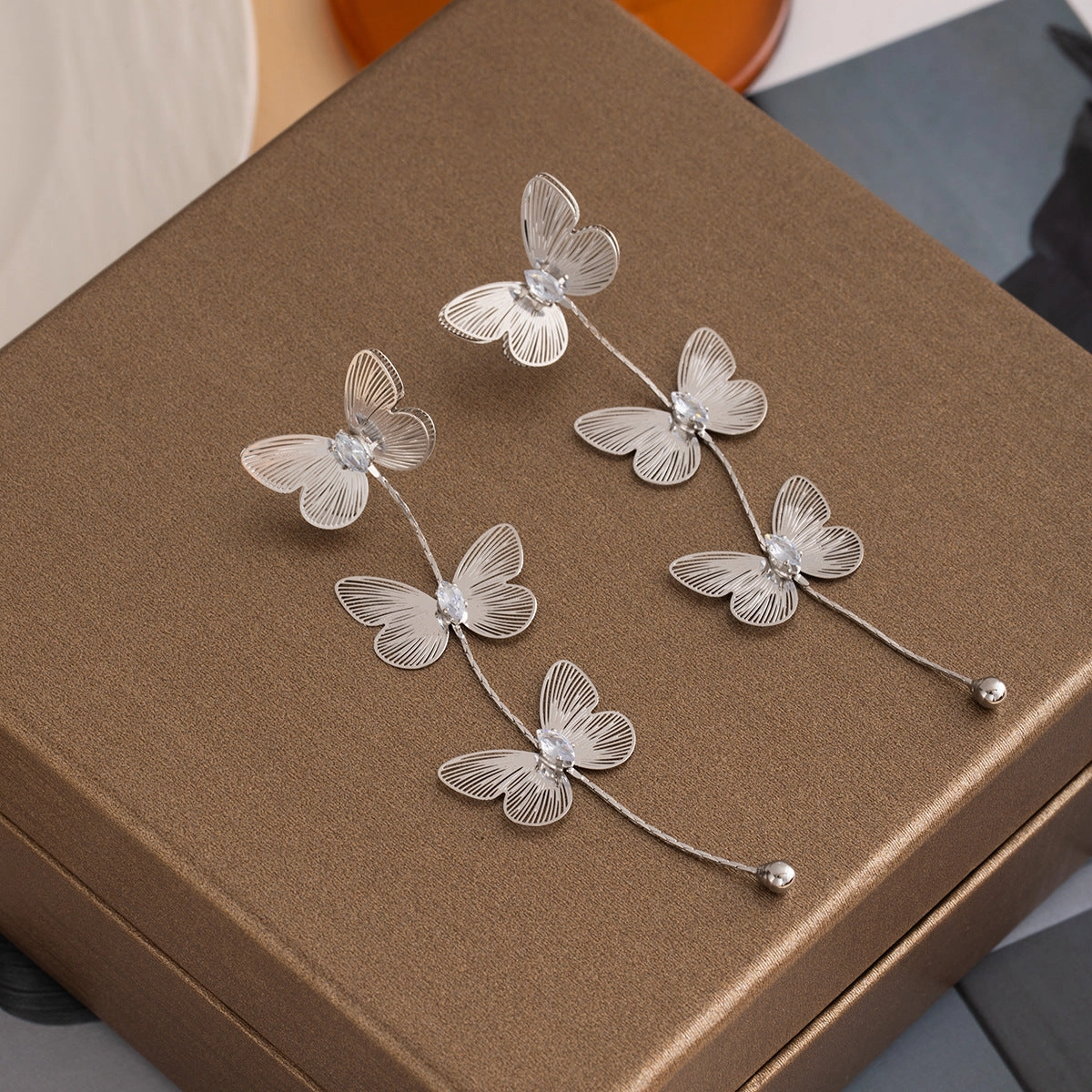 Wholesale Silver Needle Metal Style Three-Dimensional Bow Tassel Earrings