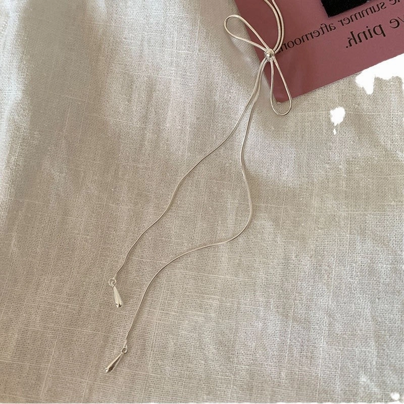 Wholesale Simple bow pull-out long necklace sweater chain