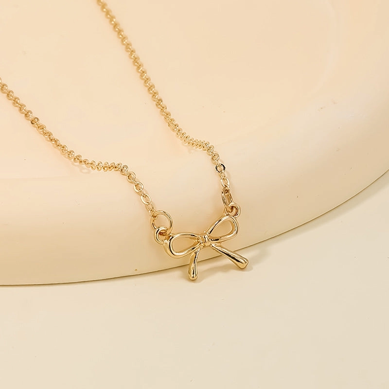 Wholesale sweet metal diamond bow necklace