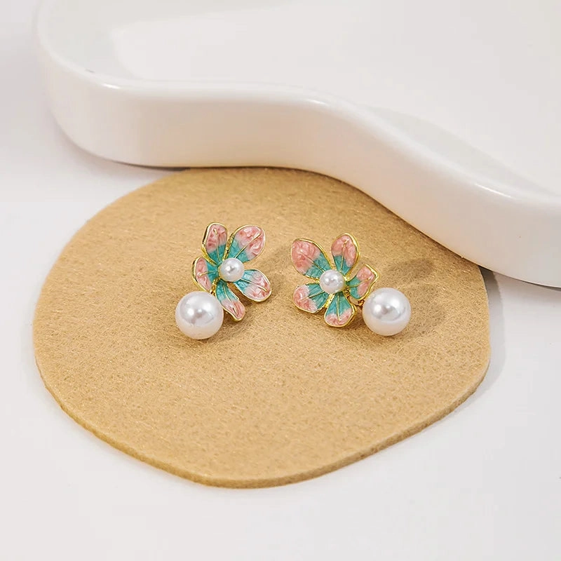 Wholesale Sweet oil-drop flower pearl earrings enamel powder blue petal earrings