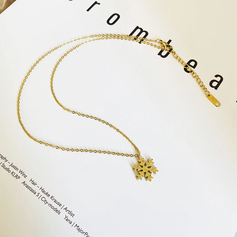 Wholesale Titanium Steel Color Gold Frosted Small Snowflake Necklace
